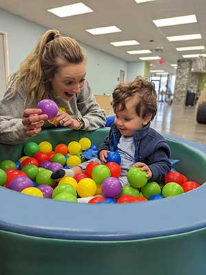 Emma, OTR, provides therapy through play in our toddler gym