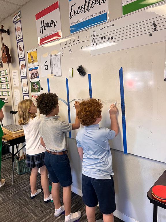 Students practice vertical writing