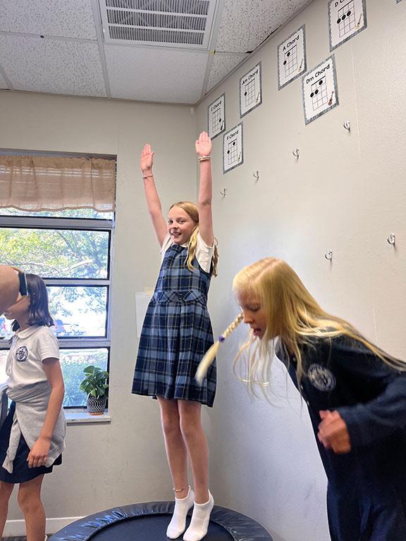 A student regulates and finds fun in sensory processing and motor skills in her Motor Lab at Valor Preparatory Academy, Waco, TX