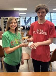 Elite Futures student working the Elite Cafe that takes coffee orders and prepares them for staff all during the guidance and support of an OT