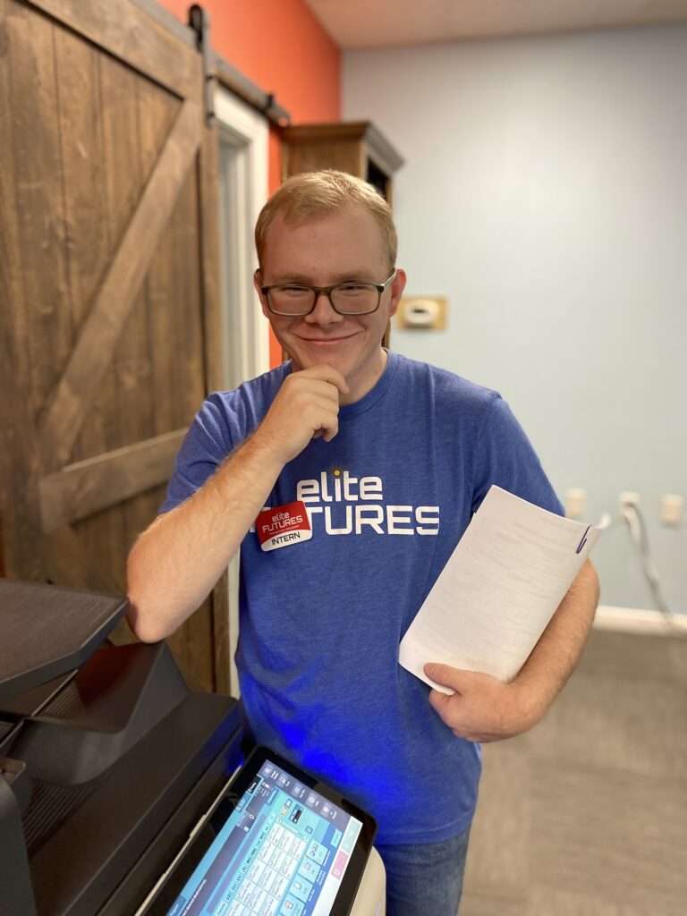 VRTP student shown working in the front office making copies and sorting files